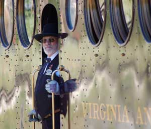 Conductor Russ Tanner on the McKeen Motor Car